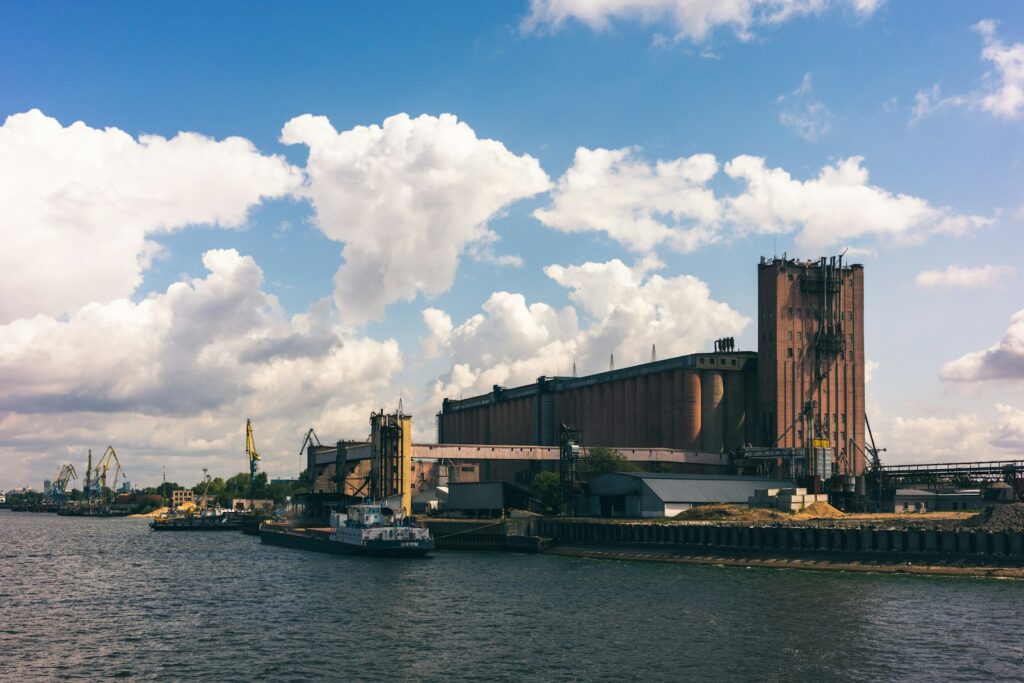 a body of water with a large building on the side of it