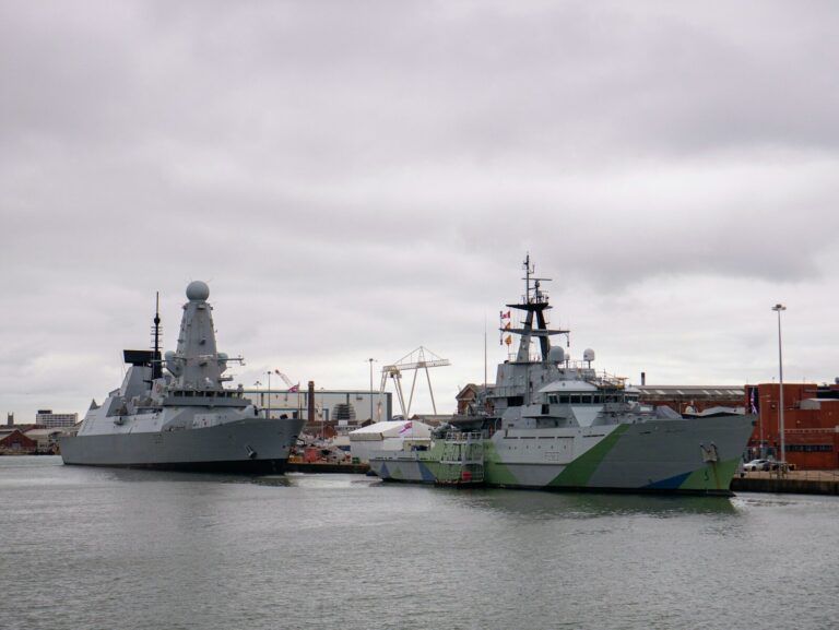 A couple of boats that are sitting in the water